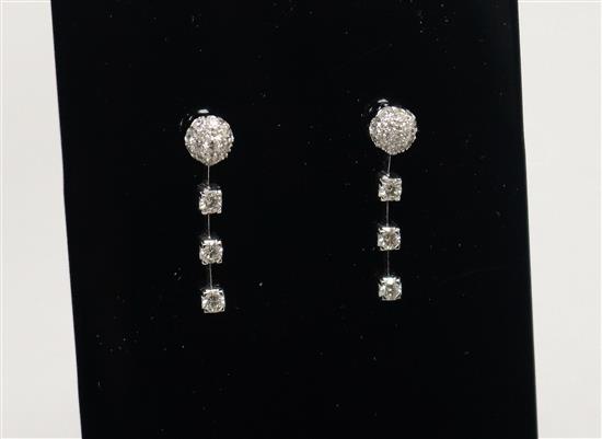 A modern pair of 18ct white gold and diamond cluster and drop earrings, 28mm.